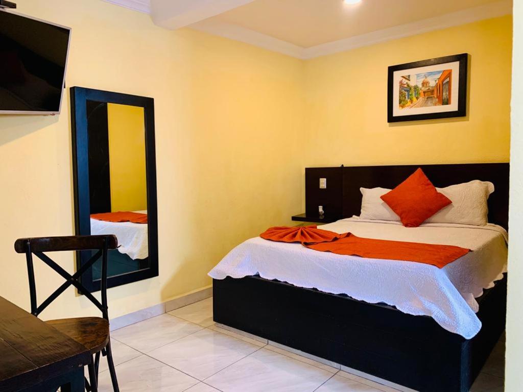 Postel nebo postele na pokoji v ubytování Hotel Boutique Rosa de Lima