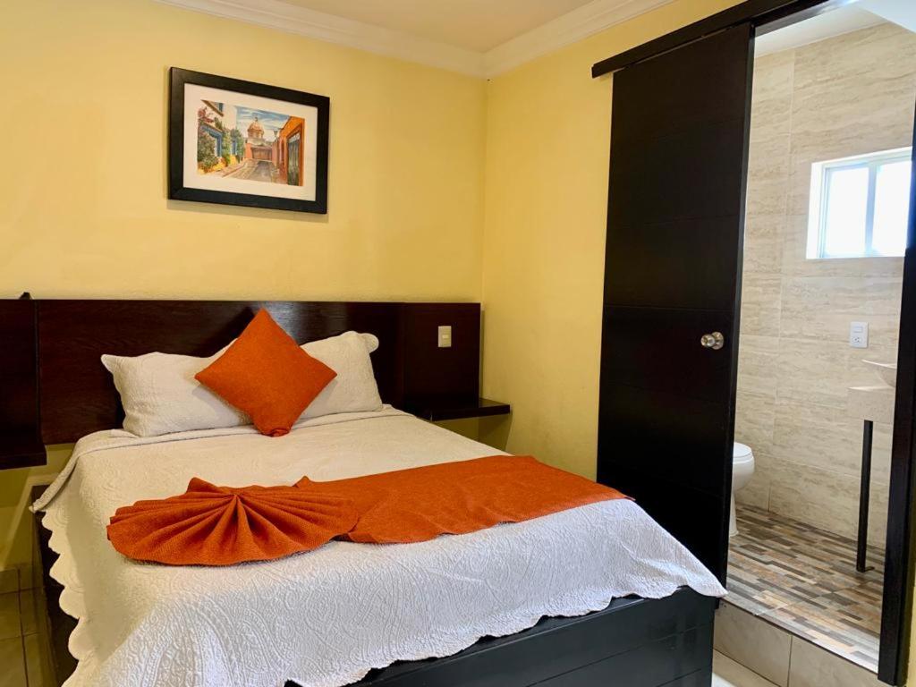 Postel nebo postele na pokoji v ubytování Hotel Boutique Rosa de Lima