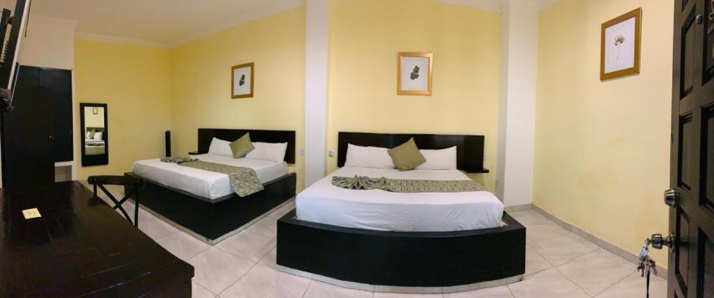 Postel nebo postele na pokoji v ubytování Hotel Boutique Rosa de Lima