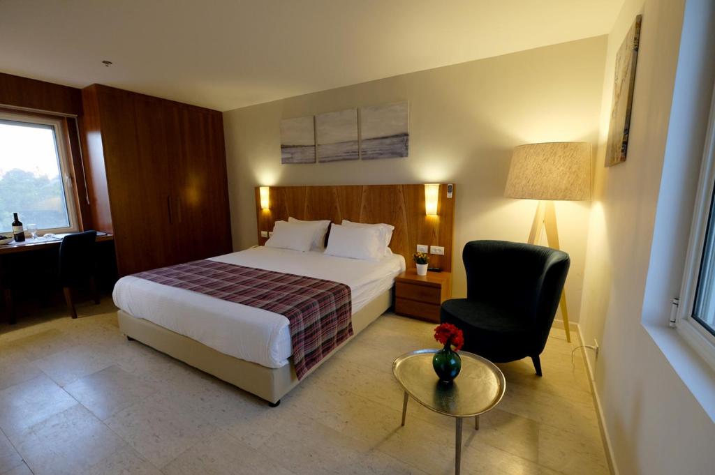 מיטה או מיטות בחדר ב-Scots House Hotel