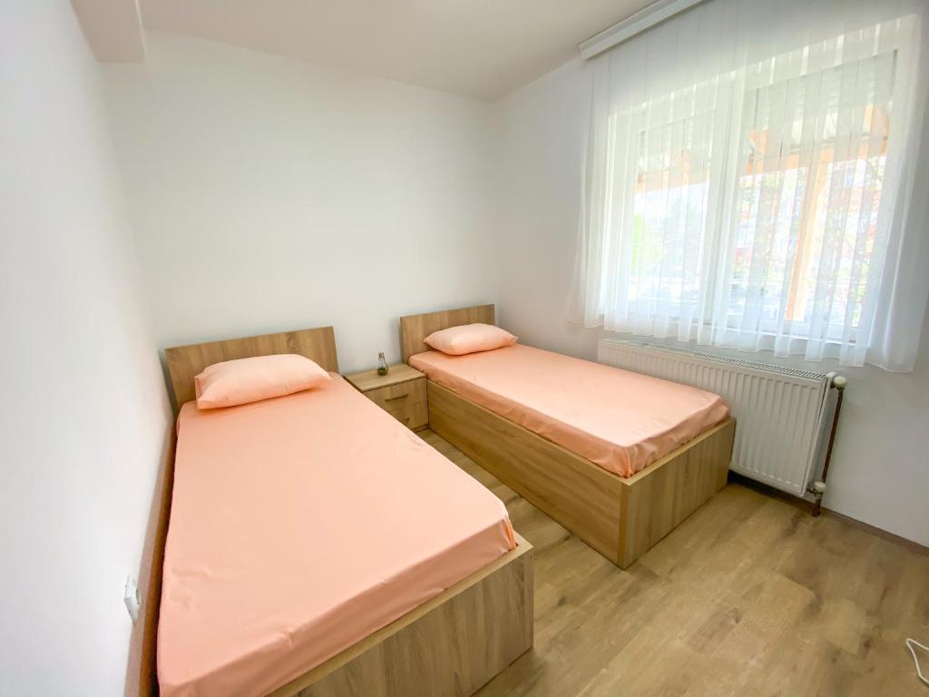 Postel nebo postele na pokoji v ubytování Rooms LikeHome