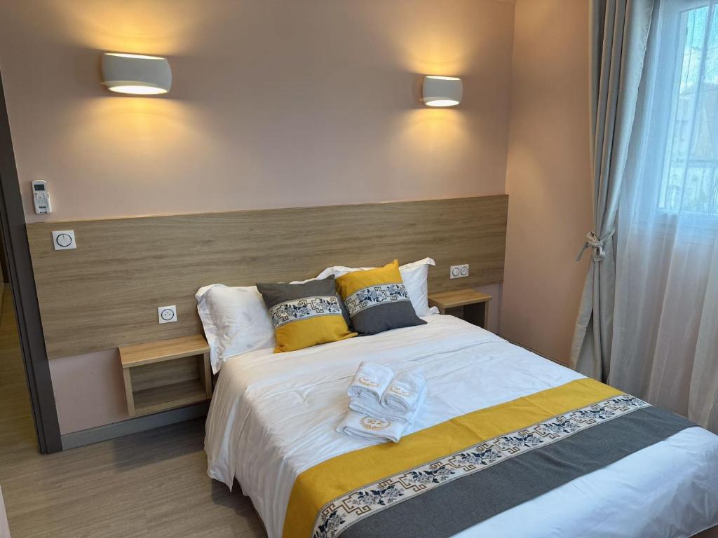 Postel nebo postele na pokoji v ubytování Chambre pour 2 personnes dans la banlieue parisienne (Bondy)