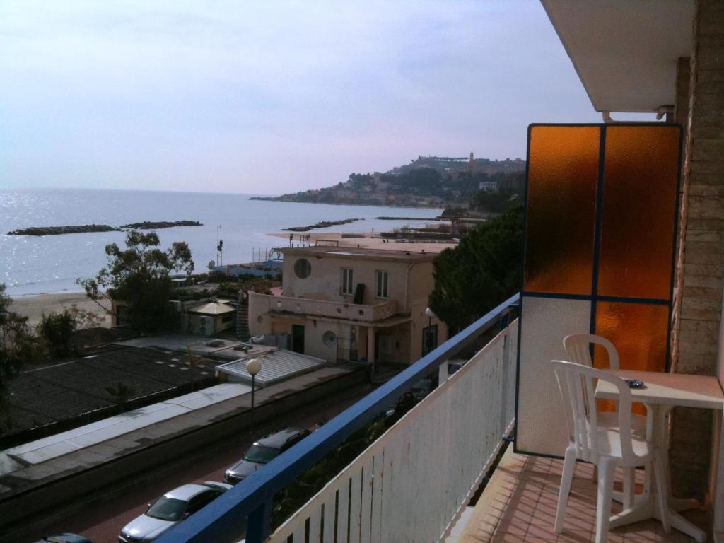 a balcony with a view of the ocean at Hotel Svizzera in Arma di Taggia