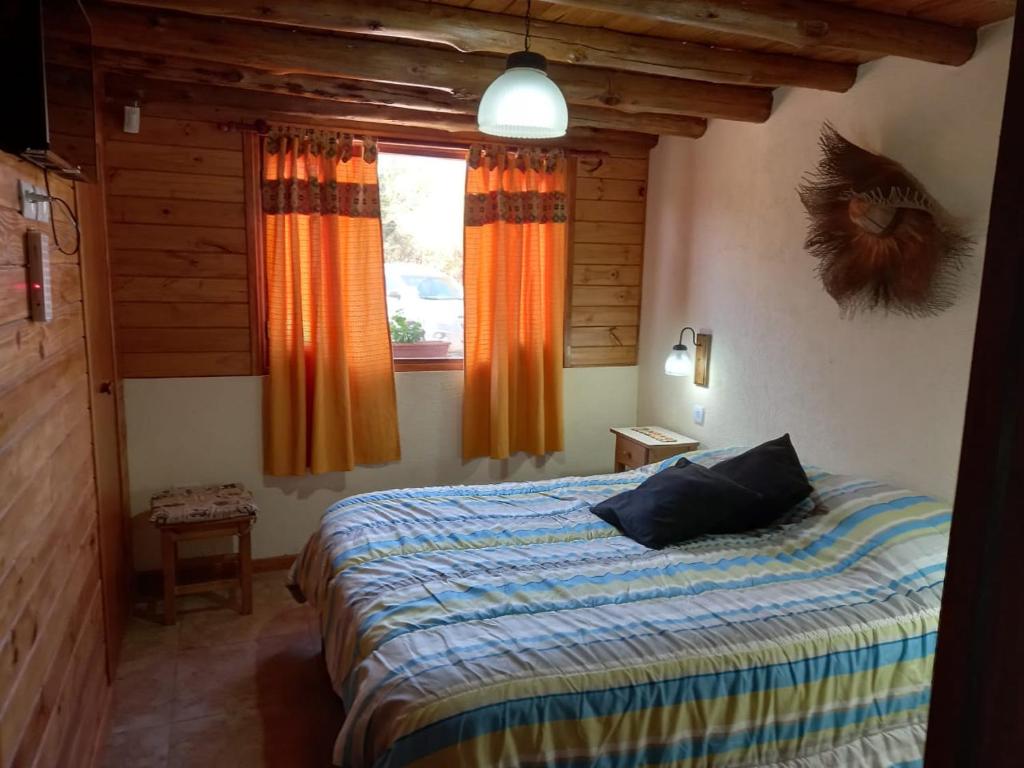 Postel nebo postele na pokoji v ubytování CABAÑAS ALMA SERENA