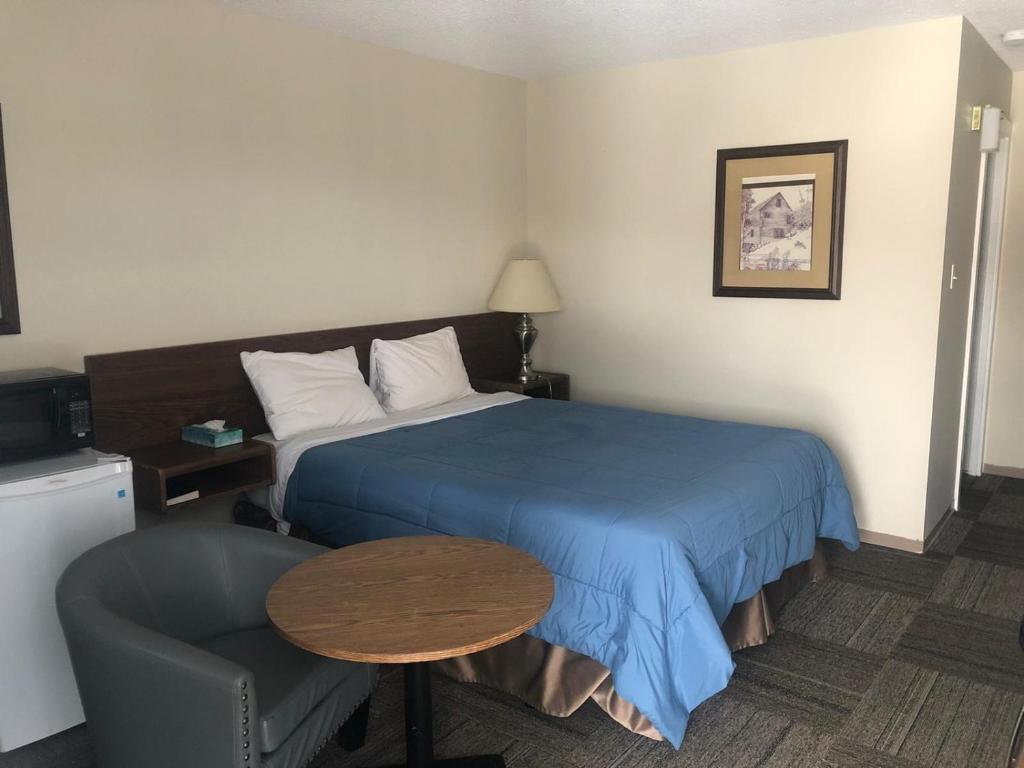 Postel nebo postele na pokoji v ubytování Houston Motor Inn