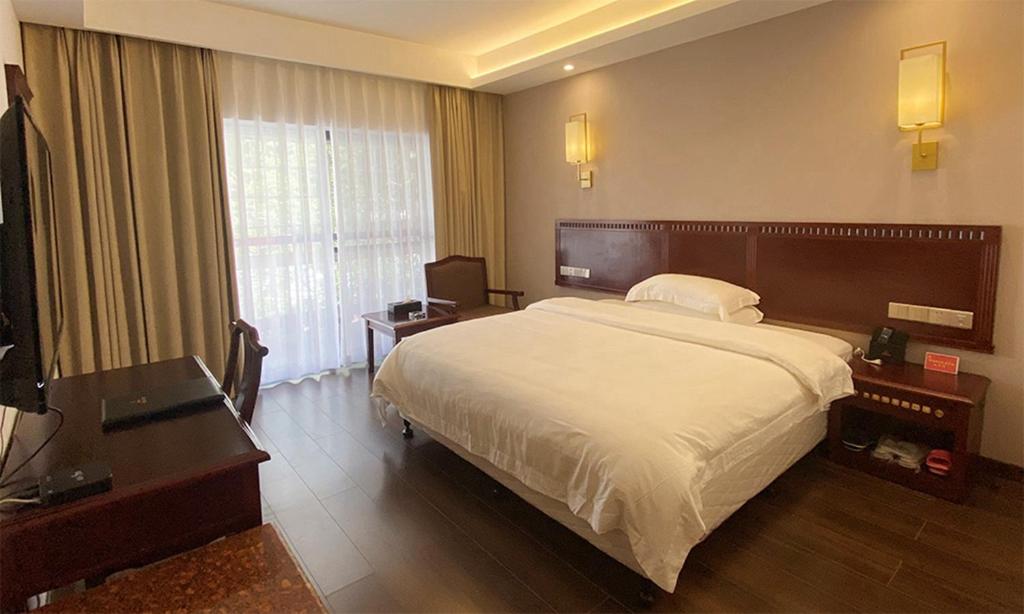 Postel nebo postele na pokoji v ubytování Hunan New Pipaxi Hotel