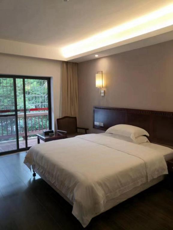 Postel nebo postele na pokoji v ubytování Hunan New Pipaxi Hotel