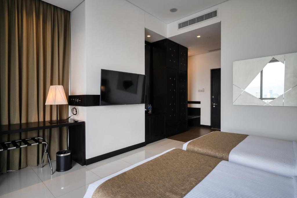 Postel nebo postele na pokoji v ubytování Orion City Hotel