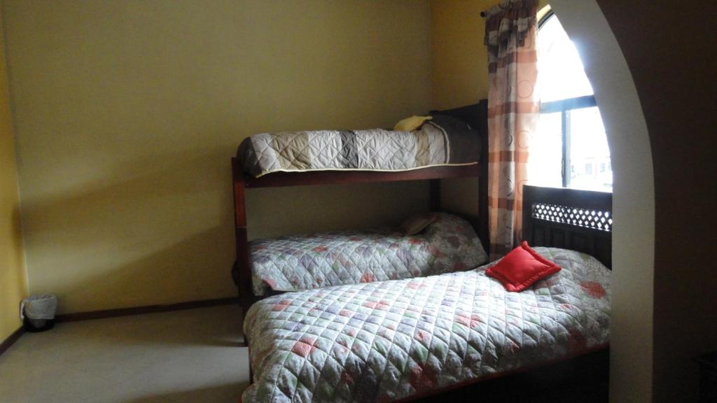 Postel nebo postele na pokoji v ubytování Hostel Del Piamonte 2
