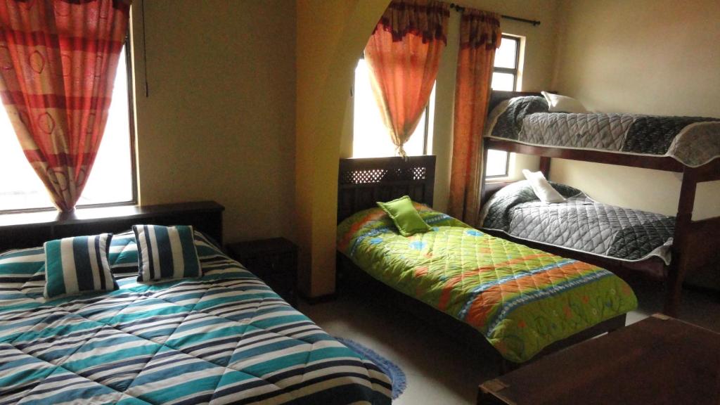 Postel nebo postele na pokoji v ubytování Hostel Del Piamonte 2