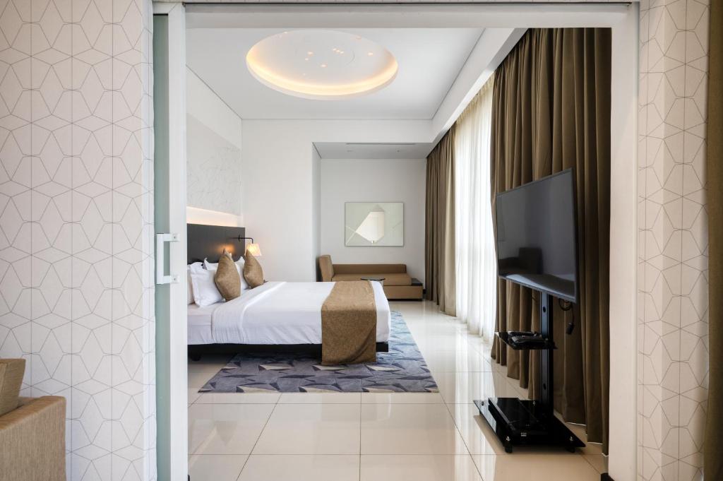 TV a/nebo společenská místnost v ubytování Orion City Hotel