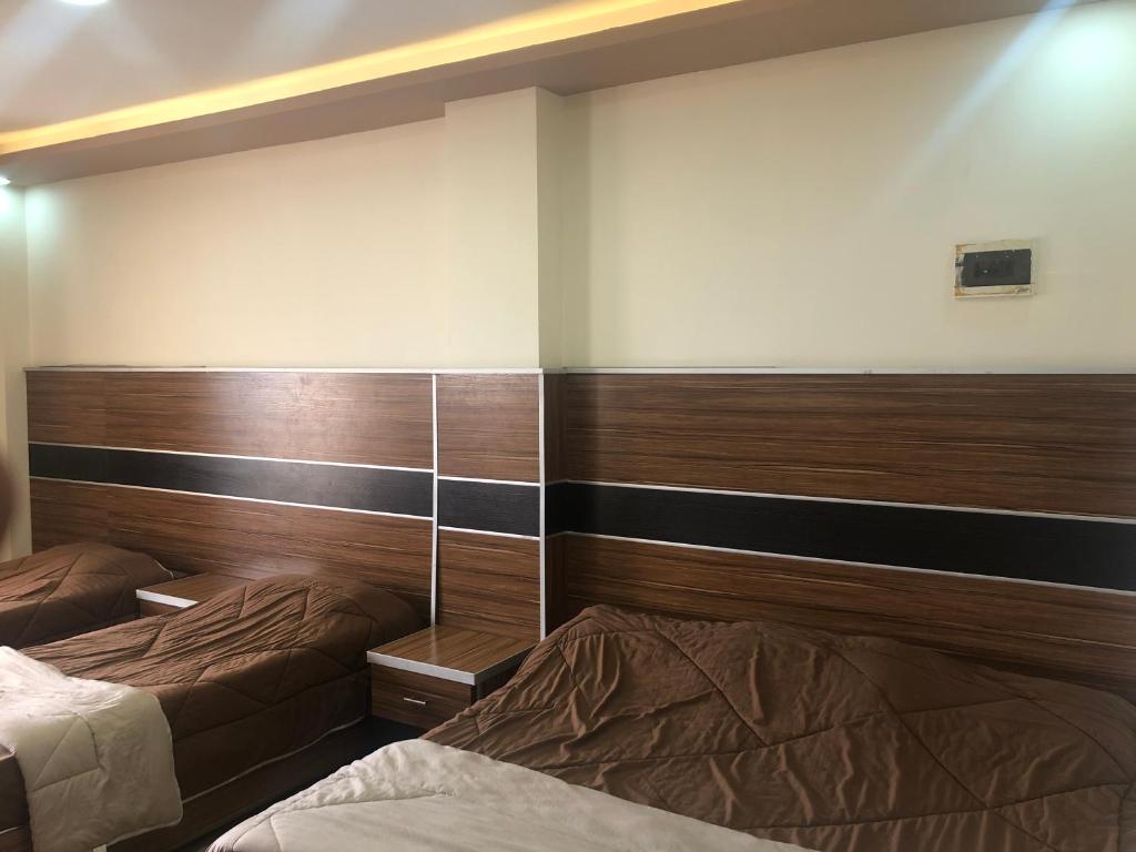 Postel nebo postele na pokoji v ubytování Al Deyafa Hotel