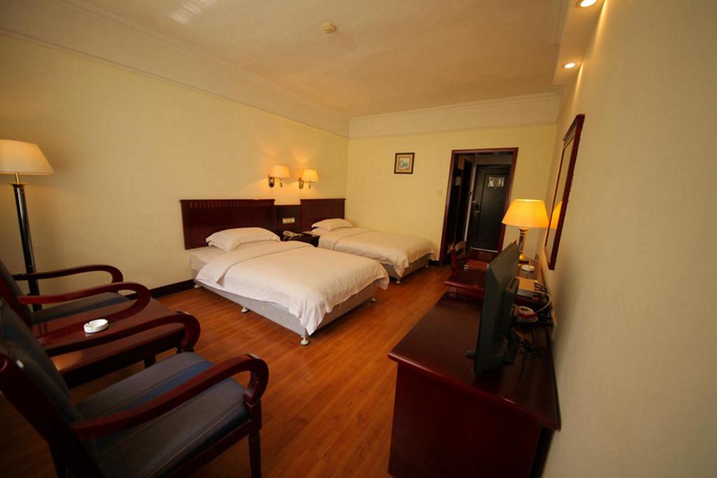 Postel nebo postele na pokoji v ubytování Hunan New Pipaxi Hotel