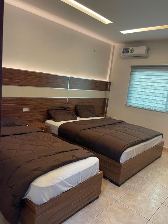 Postel nebo postele na pokoji v ubytování Al Deyafa Hotel