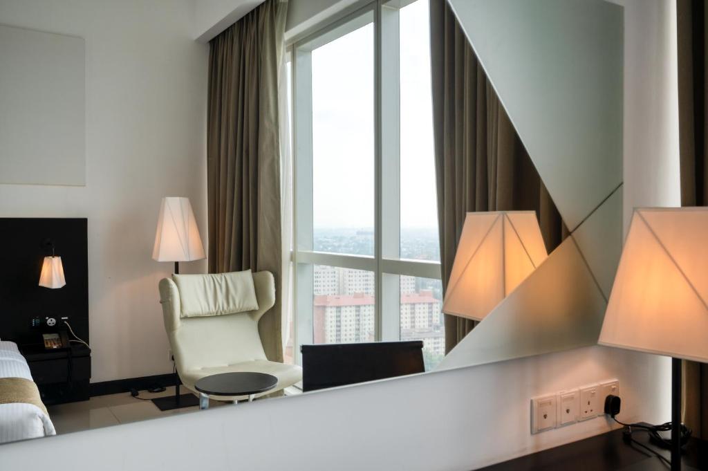 Postel nebo postele na pokoji v ubytování Orion City Hotel