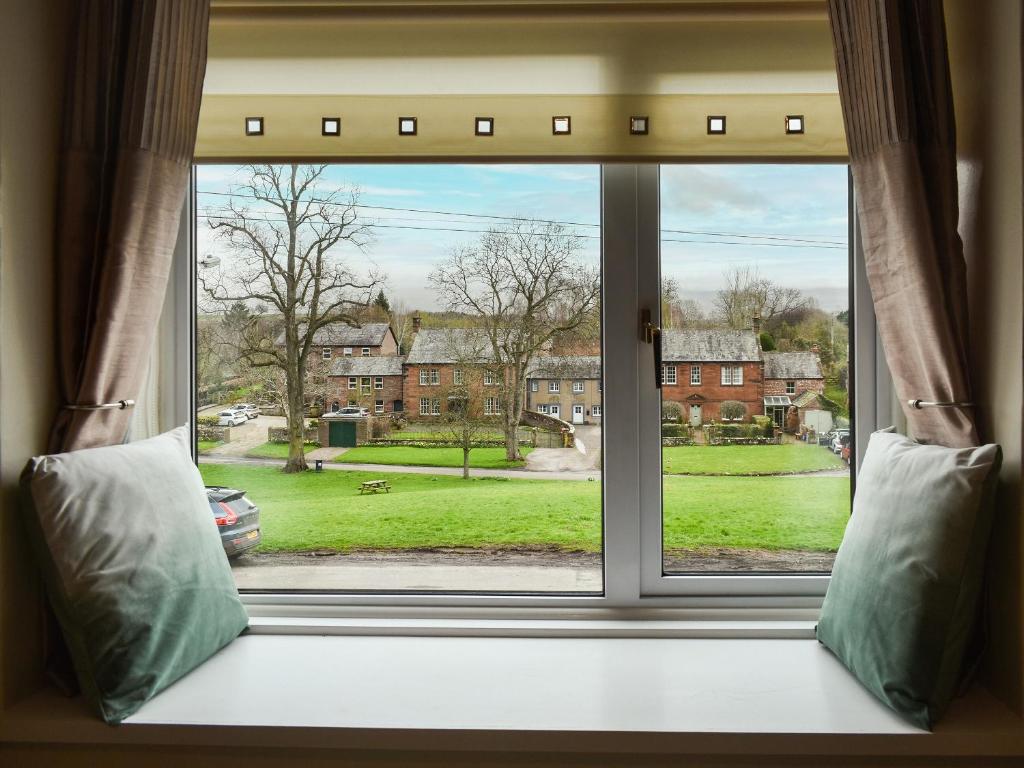 a window with a view of a green yard at Sandwath in Temple Sowerby