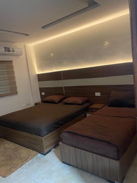 Postel nebo postele na pokoji v ubytování Al Deyafa Hotel
