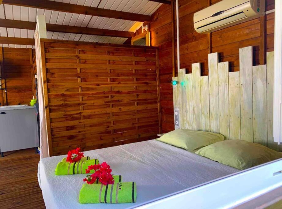 Postel nebo postele na pokoji v ubytování Bungalow Ti Kako