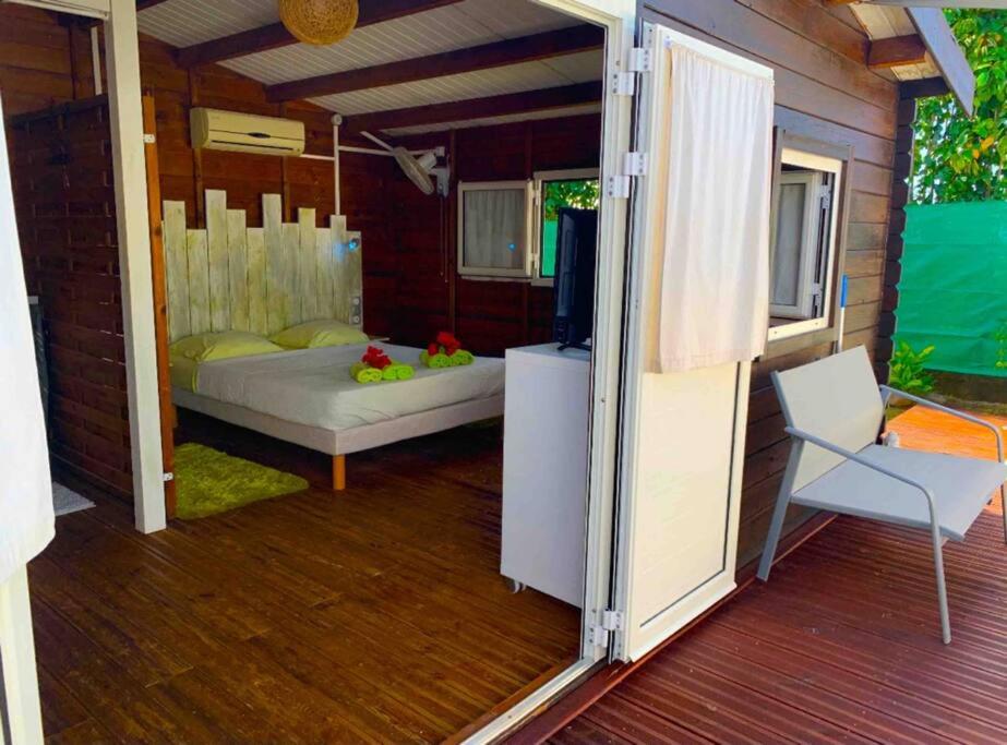 Postel nebo postele na pokoji v ubytování Bungalow Ti Kako