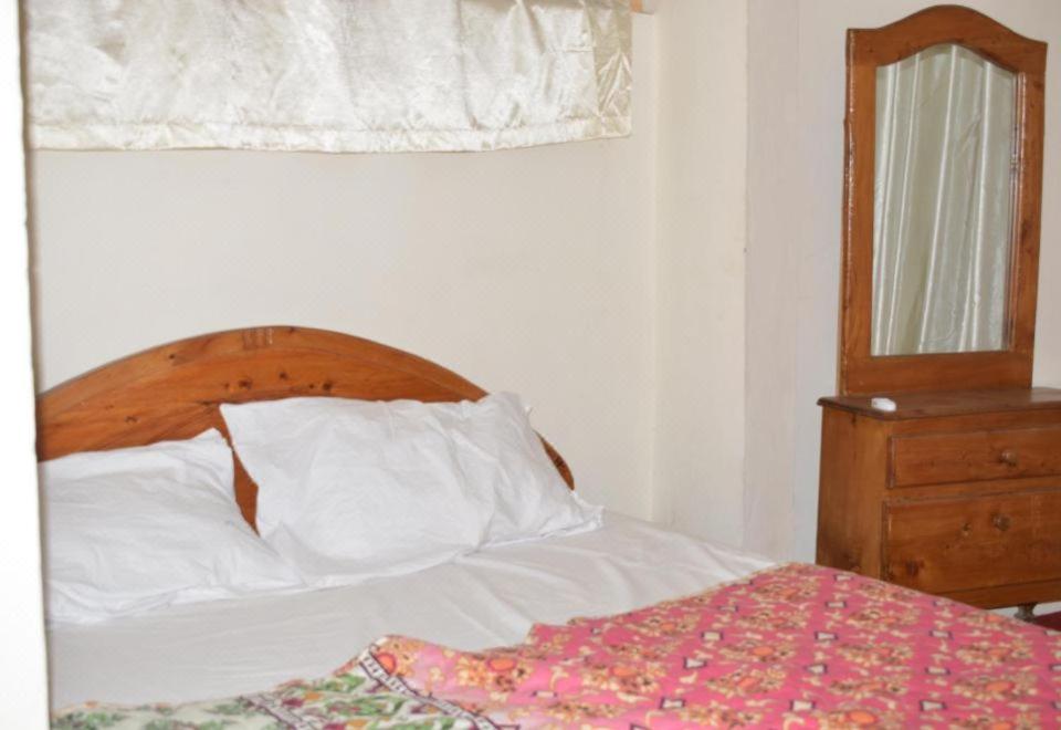 Postel nebo postele na pokoji v ubytování Highlander inn Skardu