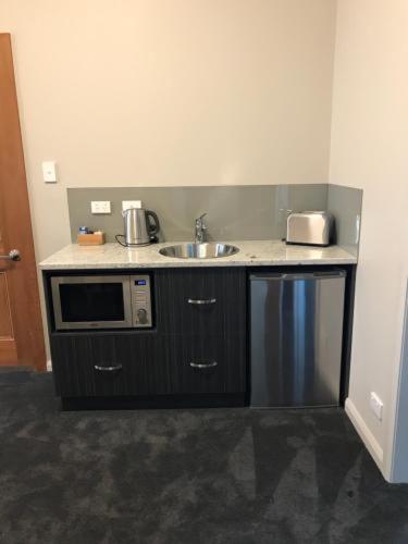 Kuchyň nebo kuchyňský kout v ubytování Lords Hotel Scottsdale