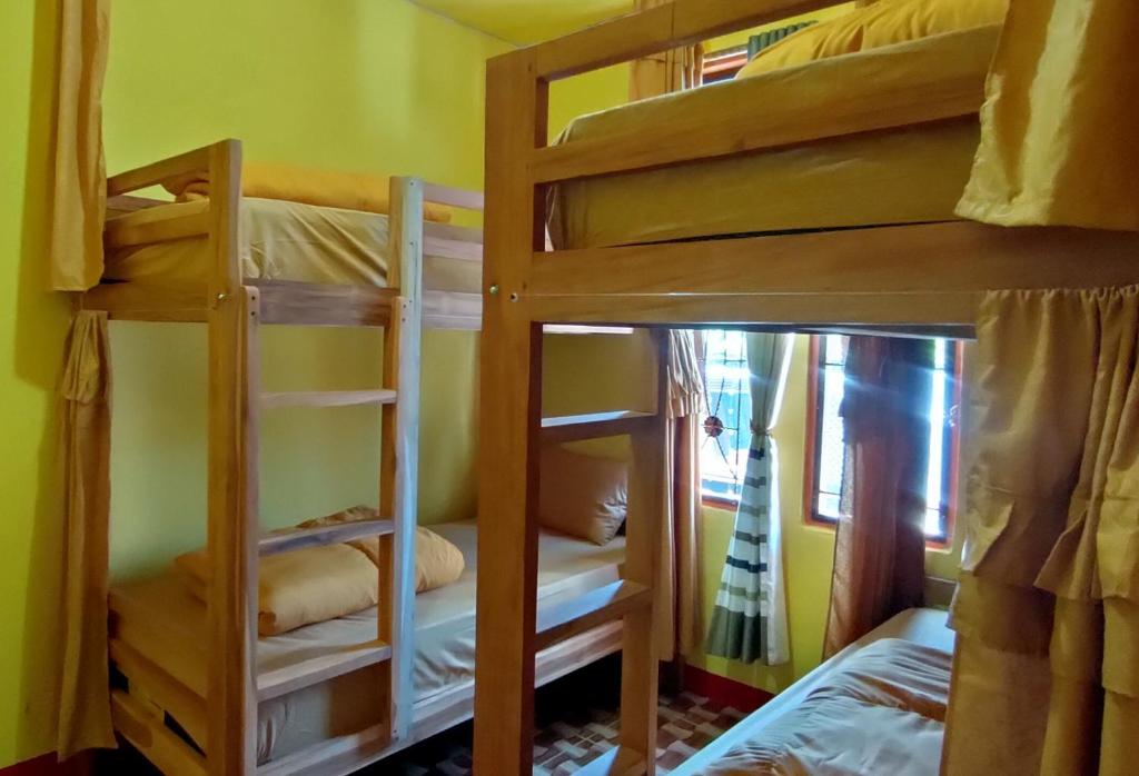 Postel nebo postele na pokoji v ubytování Ruteng Hostel
