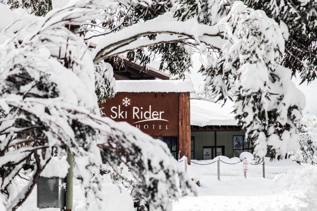 a sign for ski ridge in the snow at Ski Rider Hotel in Perisher Valley
