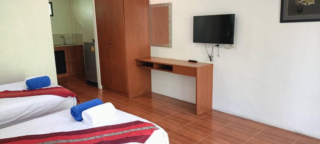 Postel nebo postele na pokoji v ubytování Baan Suan Villas Resort