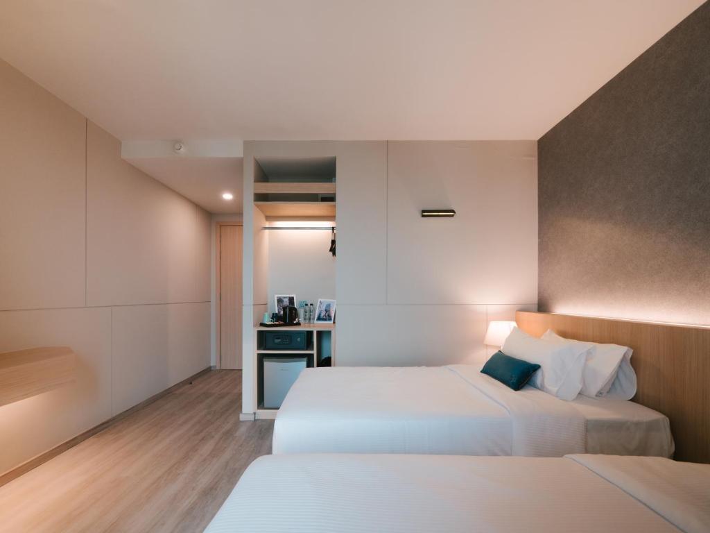Postel nebo postele na pokoji v ubytování 56 Hotel