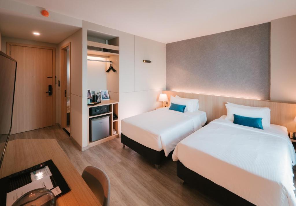 Postel nebo postele na pokoji v ubytování 56 Hotel