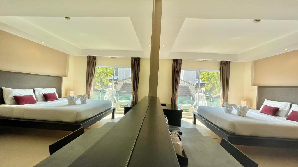 Postel nebo postele na pokoji v ubytování Baramee Resortel