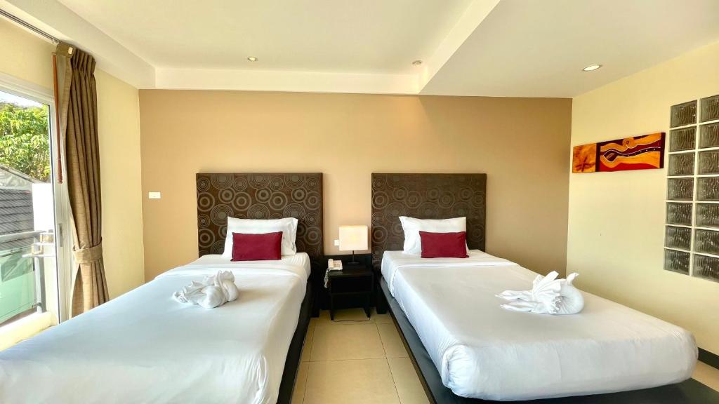 Postel nebo postele na pokoji v ubytování Baramee Resortel
