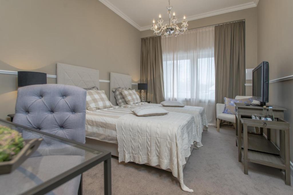 Postel nebo postele na pokoji v ubytování Hotel Wodnik