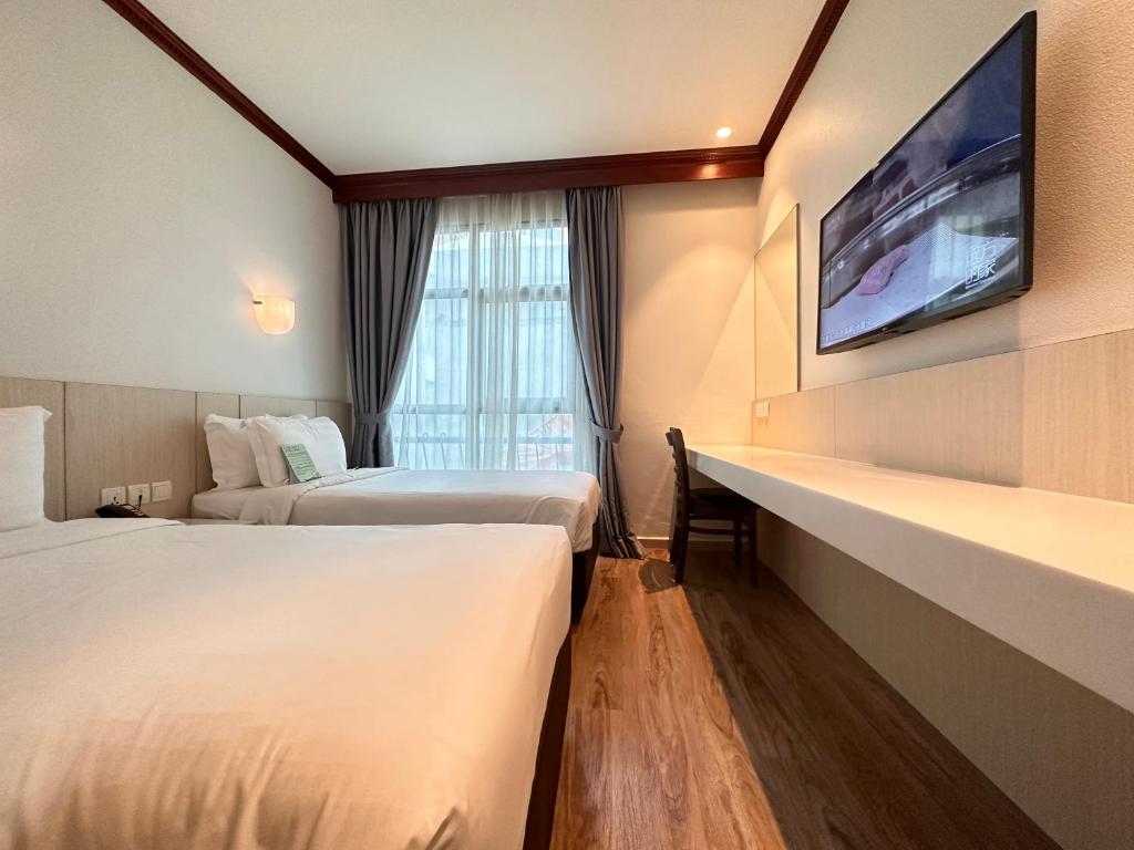 Postel nebo postele na pokoji v ubytování Park View Hotel