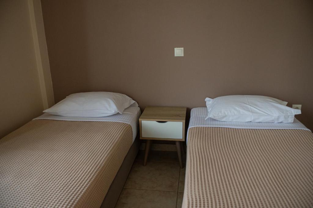 Postel nebo postele na pokoji v ubytování kostas house