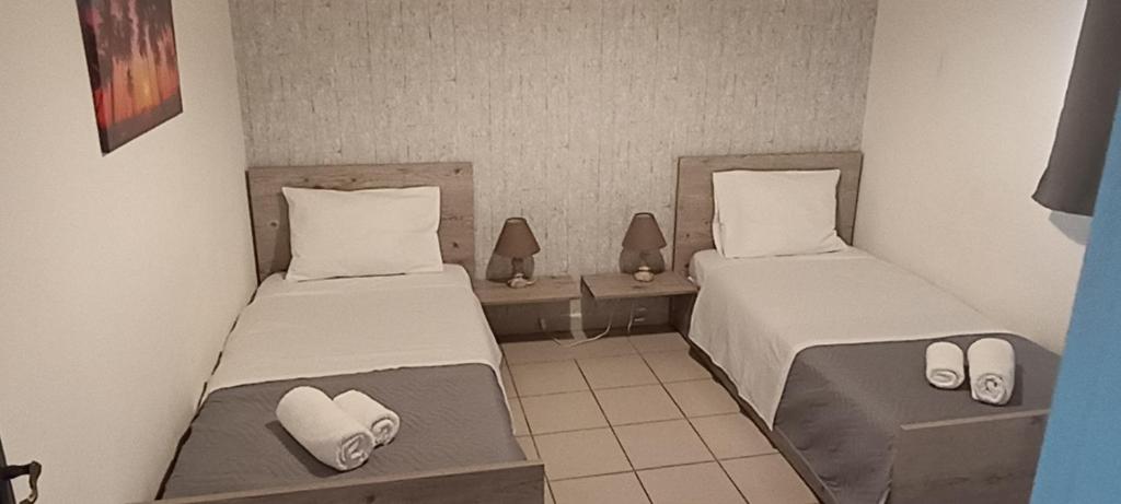 Postel nebo postele na pokoji v ubytování Poseidon room's Vourvourou