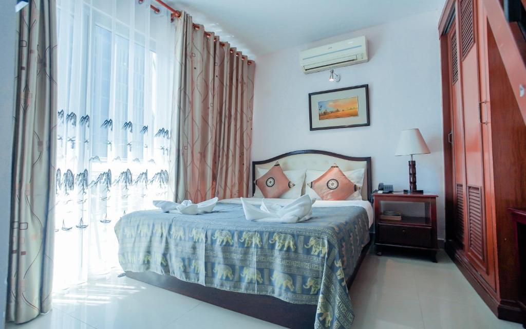 Postel nebo postele na pokoji v ubytování Silver Mounts Hotel