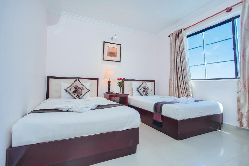 Postel nebo postele na pokoji v ubytování Silver Mounts Hotel
