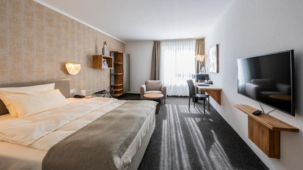 Postel nebo postele na pokoji v ubytování Best Western Plus iO Hotel