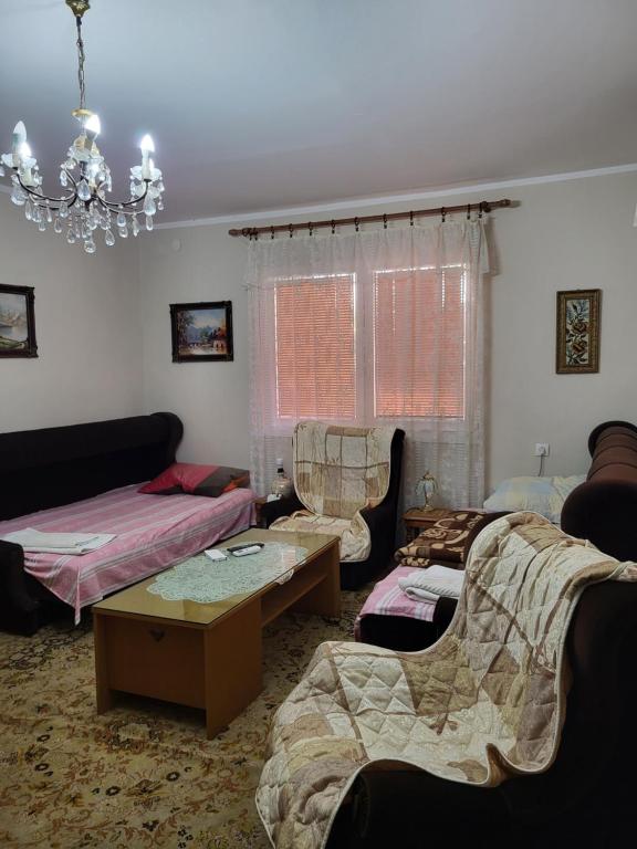 Postel nebo postele na pokoji v ubytování Kaza apartment
