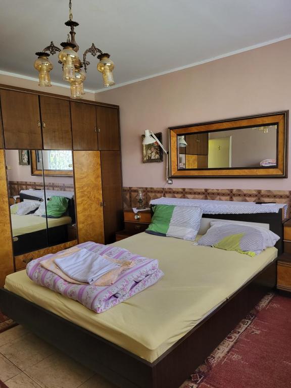 Postel nebo postele na pokoji v ubytování Kaza apartment