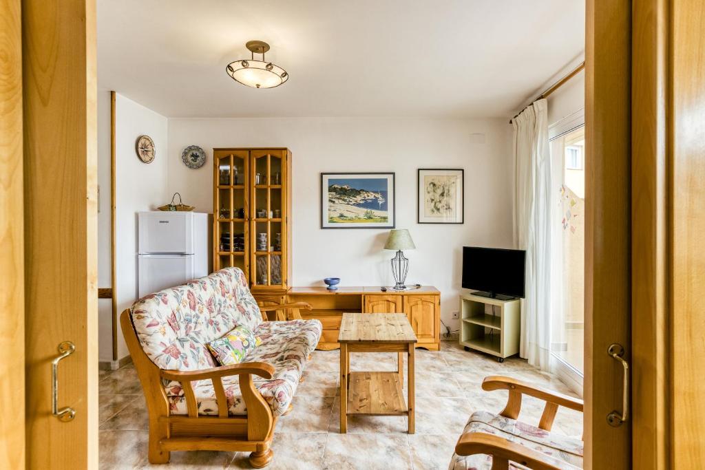 Televízia a/alebo spoločenská miestnosť v ubytovaní Montgo