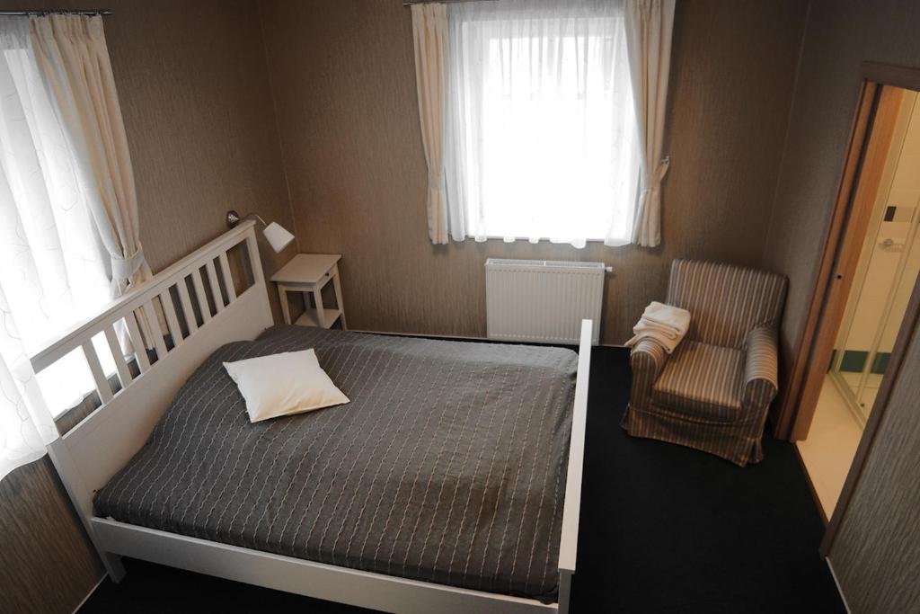 Postel nebo postele na pokoji v ubytování Hotel U Parku