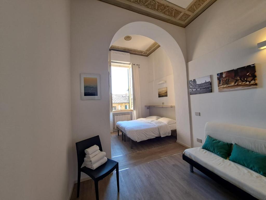 Posteľ alebo postele v izbe v ubytovaní Alloggio ristrutturato a 50 metri da Piazza del Campo