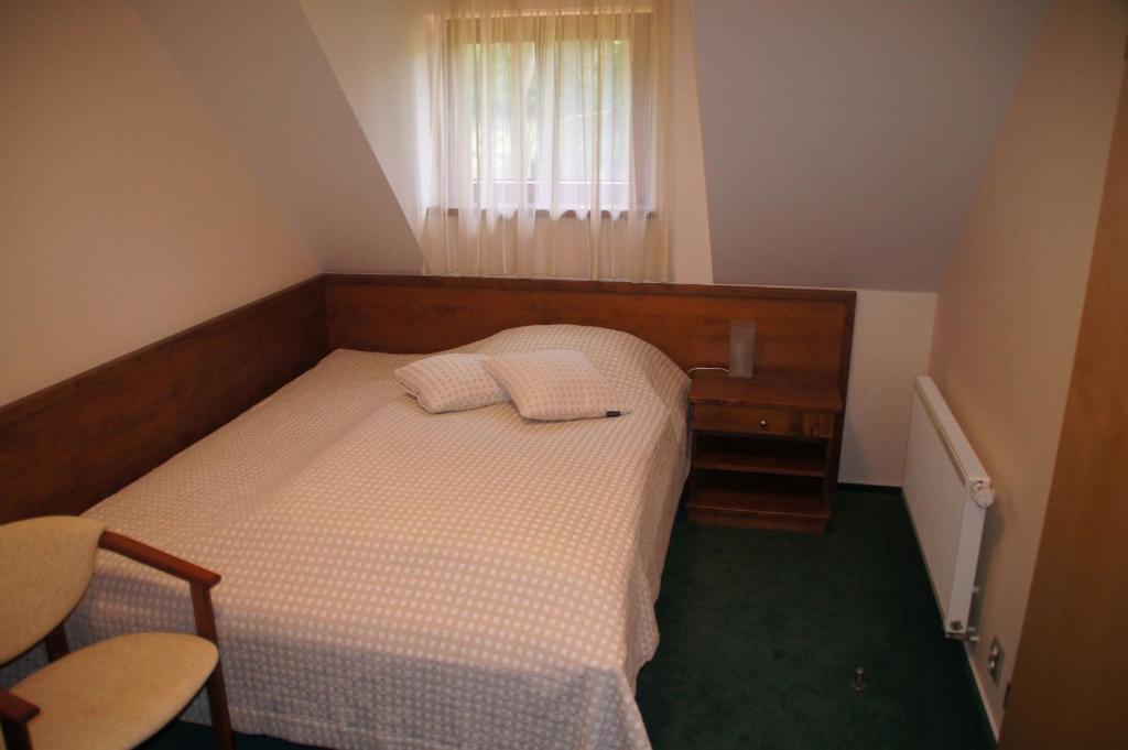 Postel nebo postele na pokoji v ubytování Hotel U Parku