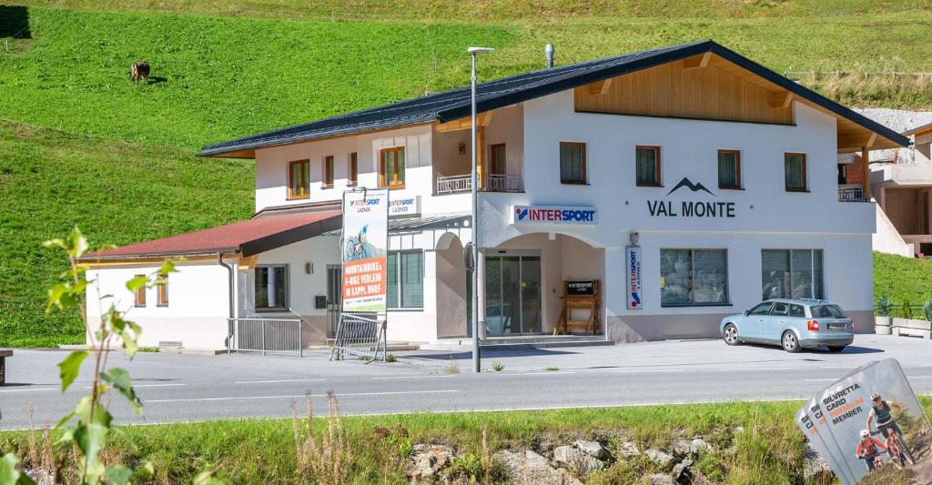 a building with a car parked in front of it at Val Monte in Kappl
