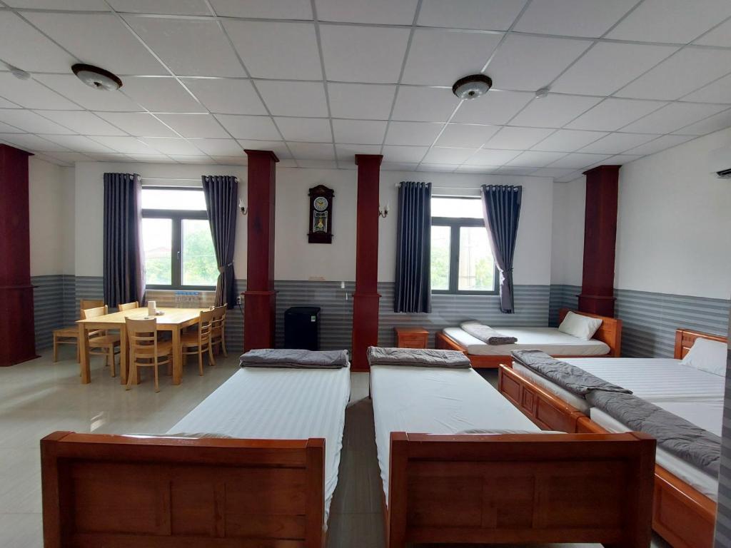 Postel nebo postele na pokoji v ubytování Hotel Sen Việt Bạc Liêu