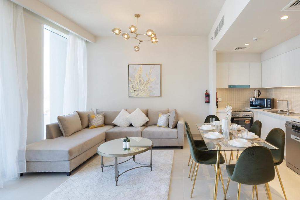 a living room with a couch and a table at Harbour Gate 1 - 2BR Apartment - Allsopp&Allsopp in Dubai