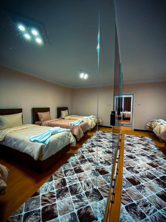 Postel nebo postele na pokoji v ubytování Eyüpsultan ABS Suites