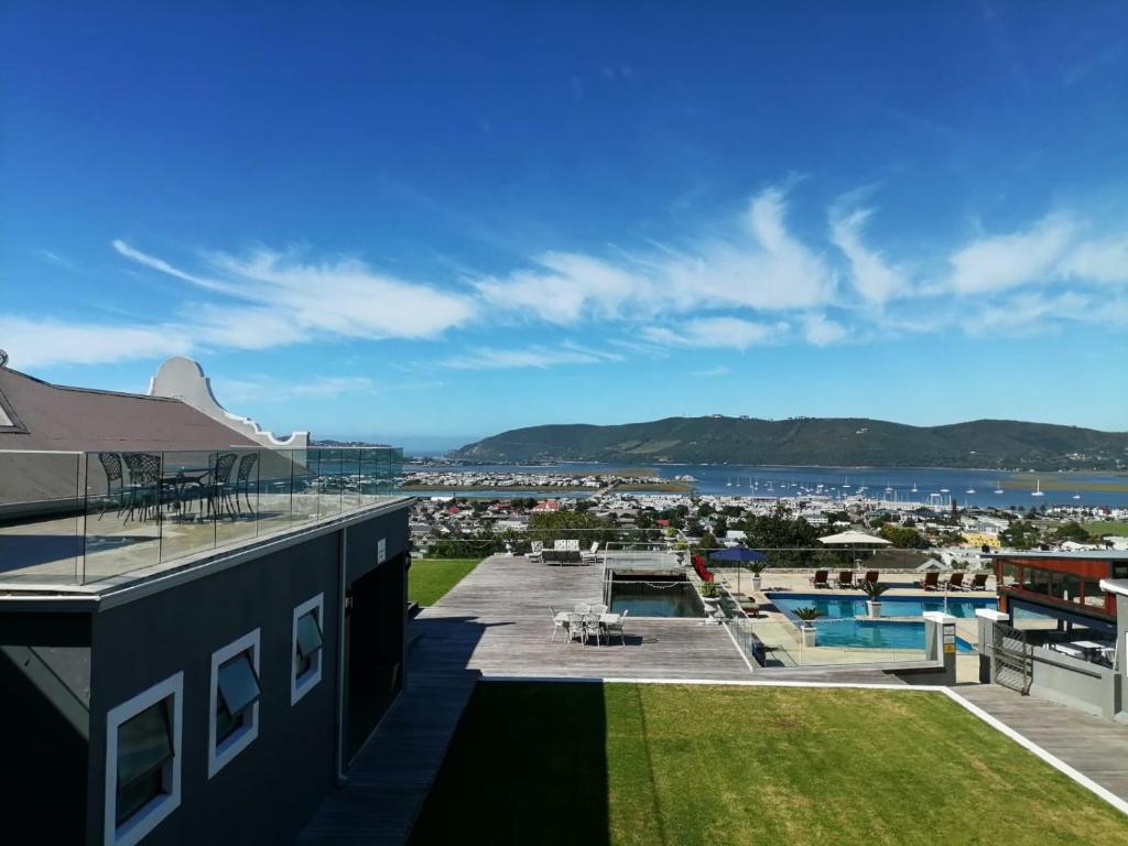 a view from the roof of a building with a swimming pool at Issaquena Heights Boutique Hotel in Knysna